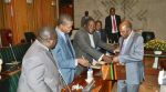 (from left) Yamfya Mukanga, Edgar Lungu , Chishimba Kambwili , Chris Yaluma  and Emmanuel Chenda  feel the copper briefcase containing the National Budget , Alexander Chikwanda (right)