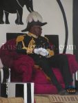 The Kuomboka Ceremony – King Lubosi Imwiko II in his bizarrely uniform of a nineteenth century British Ambassador, complete with regalia ostrich plumed-hat sited on his through at Limulunga Royal palace