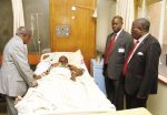 MINISTER of Information and Broadcasting Corporation Minister Mwansa (left) visits one of the Lwangwa accident survivor Patrick Phiri at the University Teaching Hospital