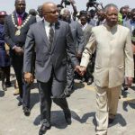 Dr. Nevers Mumba and President Sata walking hand in hand