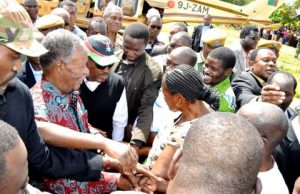 President Michael Sata upon arrival in Katuba Constituency for a rally to drum up support for PF parliamentary candidate Moses Chilando (in white T-shirt) on Feb 15,2014 -Picture by THOMAS NSAMA