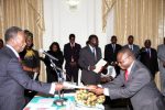 President Sata receives the affidavit of Oath from Industrial Relations Court deputy chairperson Judge Martin Musaluka during the Swearing-in-Ceremony at State House on February 20,2014 -Picture by THOMAS NSAMA