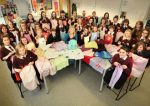 Students and teacher Stephanie Fraser at Cromwell Community College with the dresses made from pillow cases to send to Africa, for the children at Chisokone school.