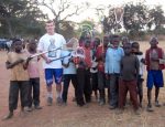 Connor Donahue of Groton, on a Bishop Guertin mission to Zambia, where he taught lacrosse to a group of young kids. (COURTESY PHOTO)