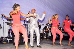 Koffi Olomide and dancing queens during the wedding ceremony of Bona Mugabe, Daughter to Robert Mugabe , President of the Republic of Zimbabwe and Simba
