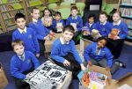 Pupils at St Stephen and All Martyrs’ School packing books for their partner school in Zambia