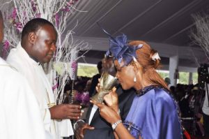 Zimbabwean President Robert Mugabe and First Lady Grace Mugabe with Fr Clifford during the wedding ceremony of their daughter Bona Mugabe and her husband Simb