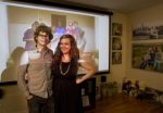 Tavis, left, and Amy Guild pose for a portrait in front of a photo of they took with members of a church in Zambia at their home in Yakima, Wash. on April 17, 2014. (KAITLYN BERNAUER / Yakima Herald-Republic)