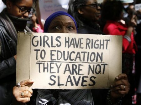 A protestor demonstrates against the kidnapping of school girls in Nigeria, outside the Nigerian Embassy in London May 9, 2014