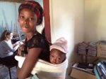 A woman and her baby in Zambia, Africa near the capital city Lusaka where engineer Dorothy Timian-Palmer has worked to help design a method to secure clean water.