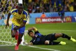 Ecuador's Enner Valencia celebrates after scoring a goal past goalkeeper Noel Valladares of Honduras during their 2014 World Cup Group E match