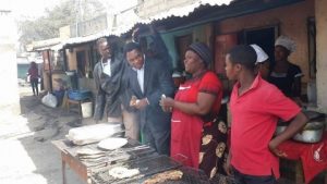 HH , 30th July 2014, at Thornpark market (ku Chusi) having lunch with the people