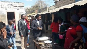 HH , 30th July 2014, at Thornpark market (ku Chusi) having lunch with the people