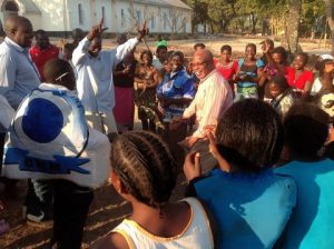 Dr Nevers Mumba dancing with Mangango supporters.