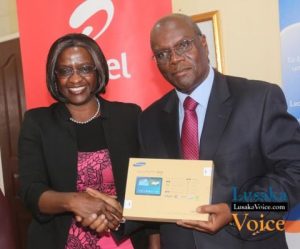 Airtel CEO Charity Chanda Lumpa and Zambia Open University Vice Chancellor Professor Mutale Musonda showing off a tablet; Airtel and ZAOU have launched a loan Scheme that will enable the ZOAU members of the Senate to acquire tablets that they will be paying monthly, the ceremony took place at ZOU senate boardroom off Mumbwa road in Lusaka West on Wednesday, September 24th, 2014.