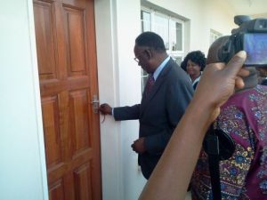 Minister of Health opening the door