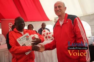 Ministry of Education and Early Childhood PS Dr Patrick Nkanza receiving from Zanaco MD Dick Bruce some soccer balls meant to selected Lusaka based primary schools ,the ceremony took place at the ZANACO Sunset Stadium