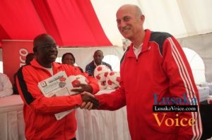 Ministry of Education and Early Childhood PS Dr Patrick Nkanza receiving from Zanaco MD Dick Bruce some soccer balls meant to selected Lusaka based primary schools ,the ceremony took place at the ZANACO Sunset Stadium