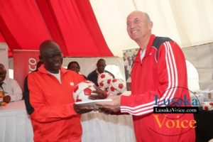 Ministry of Education and Early Childhood PS Dr Patrick Nkanza receiving from Zanaco MD Dick Bruce some soccer balls meant to selected Lusaka based primary schools ,the ceremony took place at the ZANACO Sunset Stadium