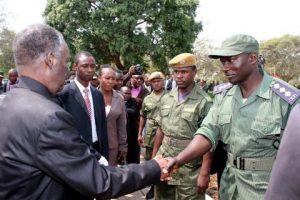 President Sata greets police officers on arrival at the National Assembly of Zambia for the opening of parliament on September 19, 2014 -Picture by THOMAS NSAMA