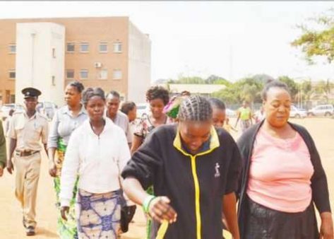 BISHOP Rose Kayanda (right), of Jesus Soul Ministries being led to Lusaka Central Prison after appearing in court accused of beating up magistrate Exildah Chanda and her husband Rabison