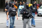 Police officers patrol downtown Ottawa, which was placed in lockdown amid a sweep for any other gunmen. Photograph- Lars Hagberg:AFP:Getty