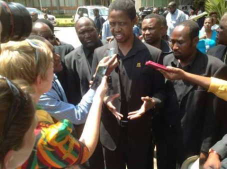 PF Secretary General Edgar Lungu talks to the media during the funeral procession.