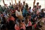 Preschool and kindergarten students at rabondo’s nursery practice the alphabet. Due to overcrowding in the primary school, the younger students study outdoors under a thatched roof.