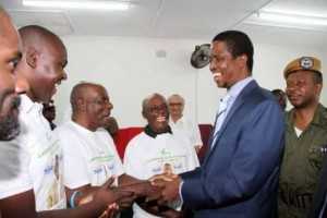 President Edgar Chagwa Lungu congratulates Chawama constituency PF parliamentary candidate Lawrence Chalwe at Chawama Basic school on March 10,2015 Chawama Constituency