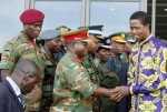 President Edgar Chagwa Lungu (right) greets Army Commander Lt. General Paul Mihova before leaving Heroes Stadium in Lusaka,Zambia on Sunday,March 8,2015. President Lungu had to leave the women’s day commemoration on advise of doctors who detected traces of malaria and fatigue.. PICTURE BY SALIM HENRY/STATE HOUSE