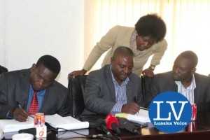 Buildcon CEO Moses Mubanga and RDA CEO Kanyuka Mumba - in a red tie- during the Chingola Solwezi Road construction Lot 2 contract signing ceremony at Mass Media area RDA offices