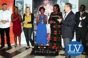 Lusaka Grand Hotel Executive Chef Eric Buitendjik , Boxer Esther Phiri, Lusaka Grand Hotel Media & Public Relations Manager Janina Baalmann , Documentary Production Director Jessie Chisi, Minister of Community Development, Mother and Child Health, Hon. Emerine Kabanshi , Esther Phiri Fights Promoter Peter Cottan and trainer Anthony Mwamba posing for a picture after the "Between Rings"documentary premier at SterKinekor Film views
