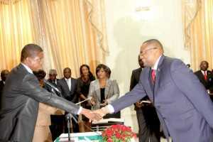 President Edgar Lungu congratulates Zambia's High Commissioner to South Africa Emmanuel Mwamba (r) during the swearing -In-Ceremony at State House on May 4,2015 -Picture by THOMAS NSAMA