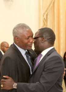 Zambia's Ambassador to France Humphrey Chibanda (r) being congratulated by State House Senior Private Secretary Ogeon Gondwe during the swearing -In-Ceremony at State House on May 4,2015 -Picture by THOMAS NSAMA