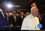 – Zambia President Edgar Chagwa Lungu (left) and Pope Francis smile as the head of the Catholic Church walks past the Zambia seat  – Photo Credit CHIBAULA D. SILWAMBA – Lusakavoice.com