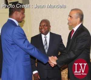 President Edgar Chagwa Lungu shaking hands with Bharti Airtel CEO and Chairman Sunil Bharti Mittal while looking on is Airtel Networks Zambia Plc Board Chairman George Sokota