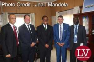 in a red tie Bharti Airtel CEO and Chairman Sunil Bharti Mittal visiting the Minister of Transport and communications Kampembwa Simbao