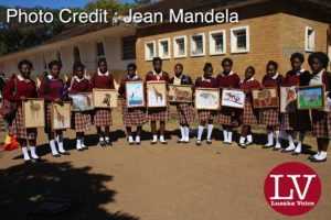 Kabulonga Girls pupils showing off their art work; the pupils were spotted at the school premises .