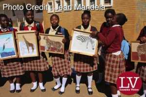 Kabulonga Girls pupils showing off their art work; the pupils were spotted at the school premises .
