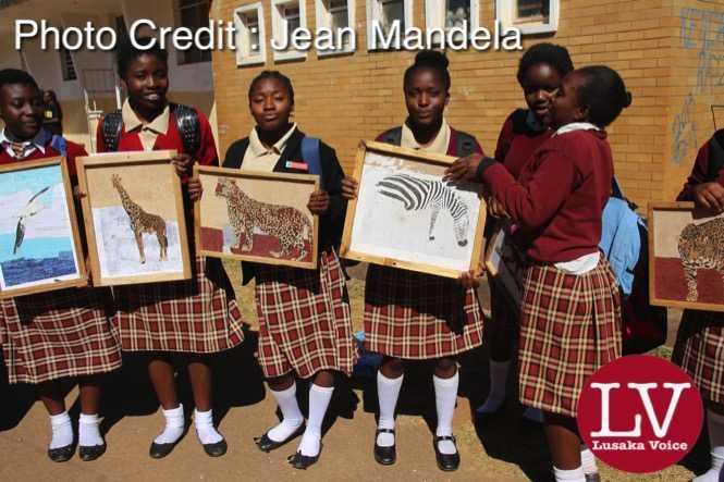 Kabulonga Girls pupils showing off their art work; the pupils were spotted at the school premises .