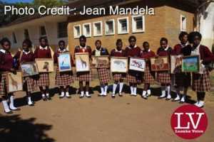 Kabulonga Girls pupils showing off their art work; the pupils were spotted at the school premises .