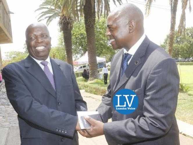 Former Minister of Finance Ngandu Peter Mangande interacting with ZACCI Vice President - Services Dr Chabu Kawesha at the NAZ premises.