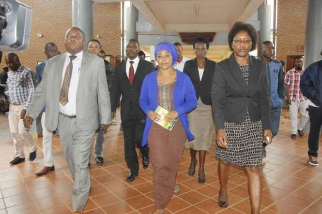 Mutinta (c) arrives at the Lusaka Magistrates’ Court this morning in the company of police officers. Picture courtesy of The Mast