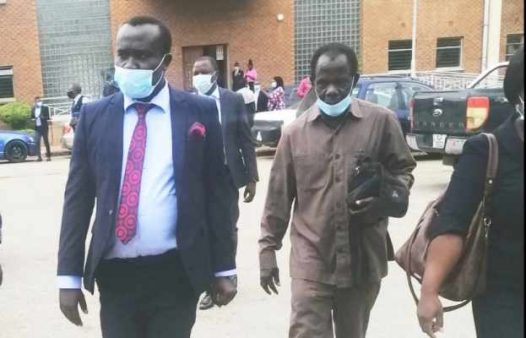 Mr Chinjenge (in suit) leaving the Lusaka Magistrate's Court this morning after the case was adjourned to December 8 this year for ruling on whether the case should be withdraw